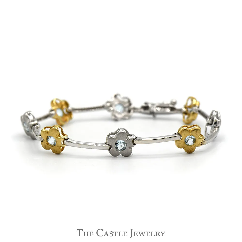 7 1/4 Inch Two Tone Flower Bar Link Bracelet with Blue Topaz Accents in 14k White & Yellow Gold