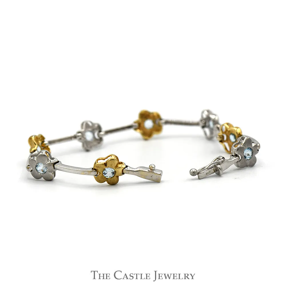 7 1/4 Inch Two Tone Flower Bar Link Bracelet with Blue Topaz Accents in 14k White & Yellow Gold